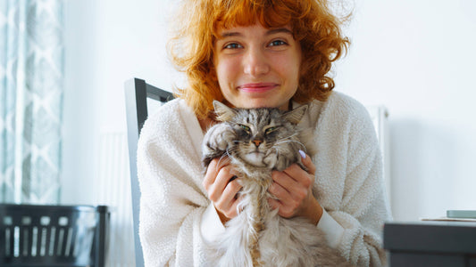 woman holding her cat 