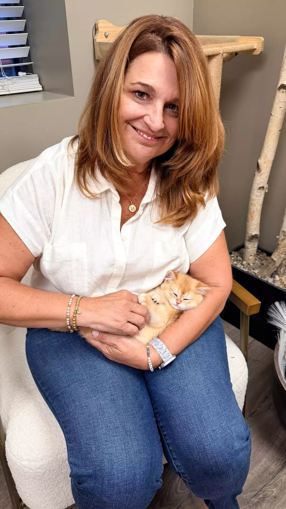 Cat mom holding cat talking about elevated litter box, LoftyLoo