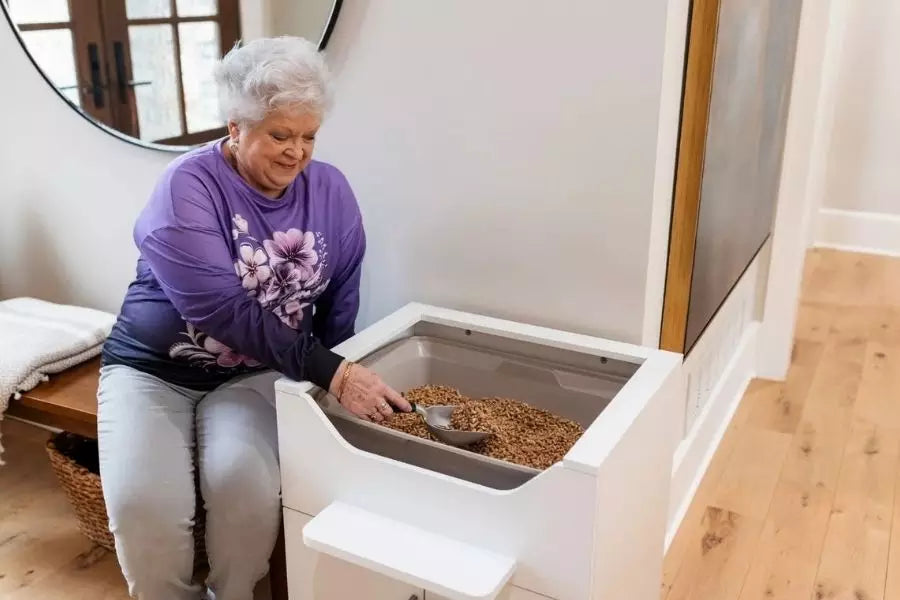 Cleaning a cat litter box comfortably while seated using LoftyLoo