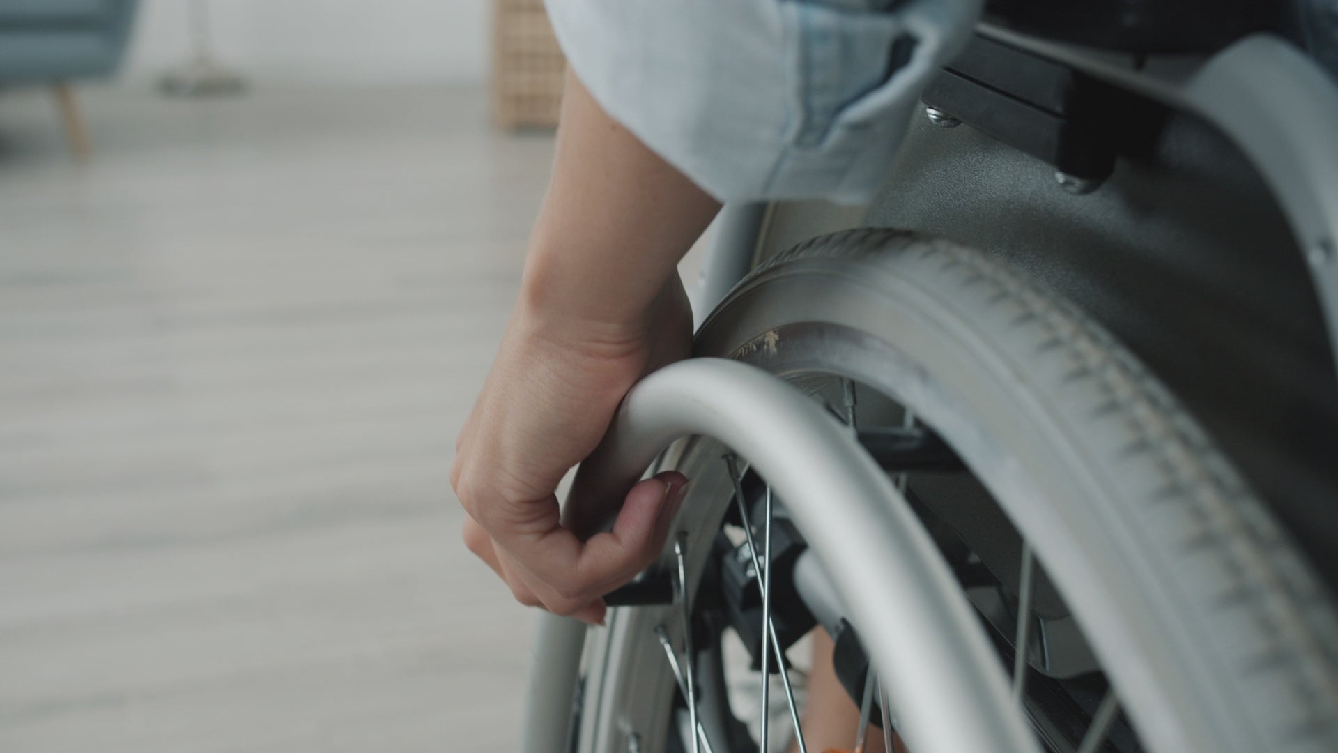 Man in a wheelchair near an accessible elevated cat litter box